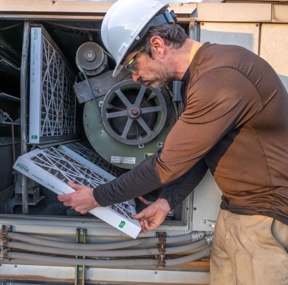 hvac technician doing a repair
