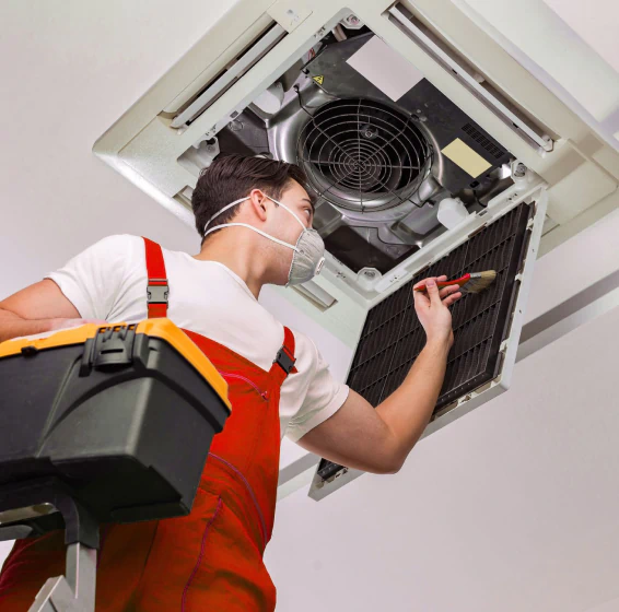 technician doing duct cleaning